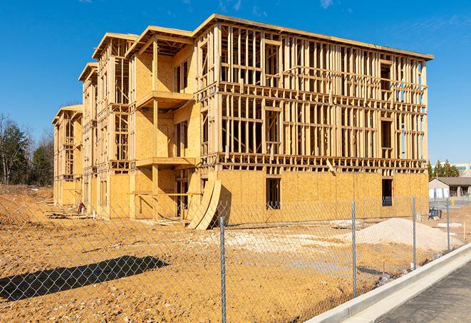 a close-up of temporary chain link fences enclosing a job site, signaling progress in the project's development in Shelbyville